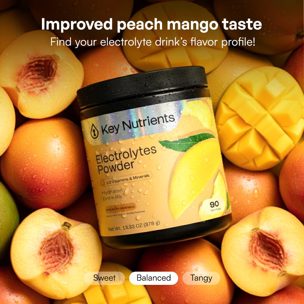 KEY NUTRIENTS vaso con bebida Peach Mango listo para beber, hidratación sin azúcar