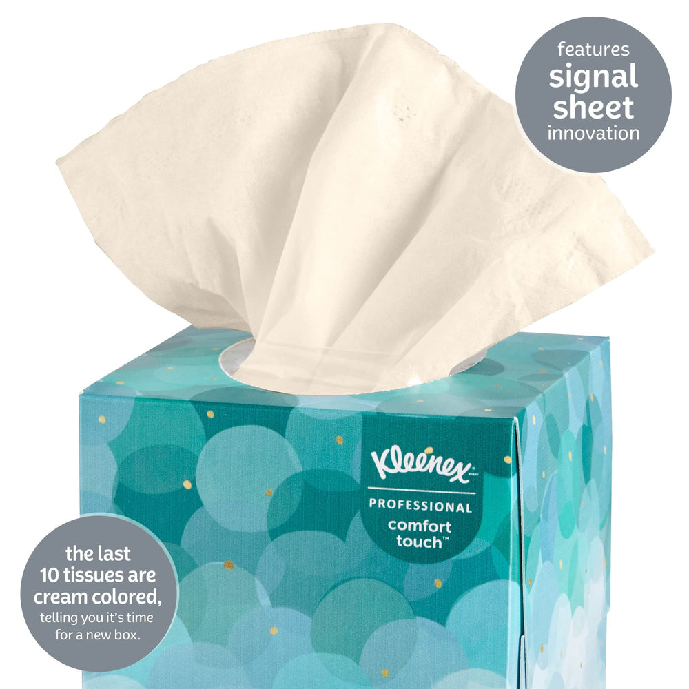 Kleenex caja abierta con pañuelo en uso, facilita extracción rápida