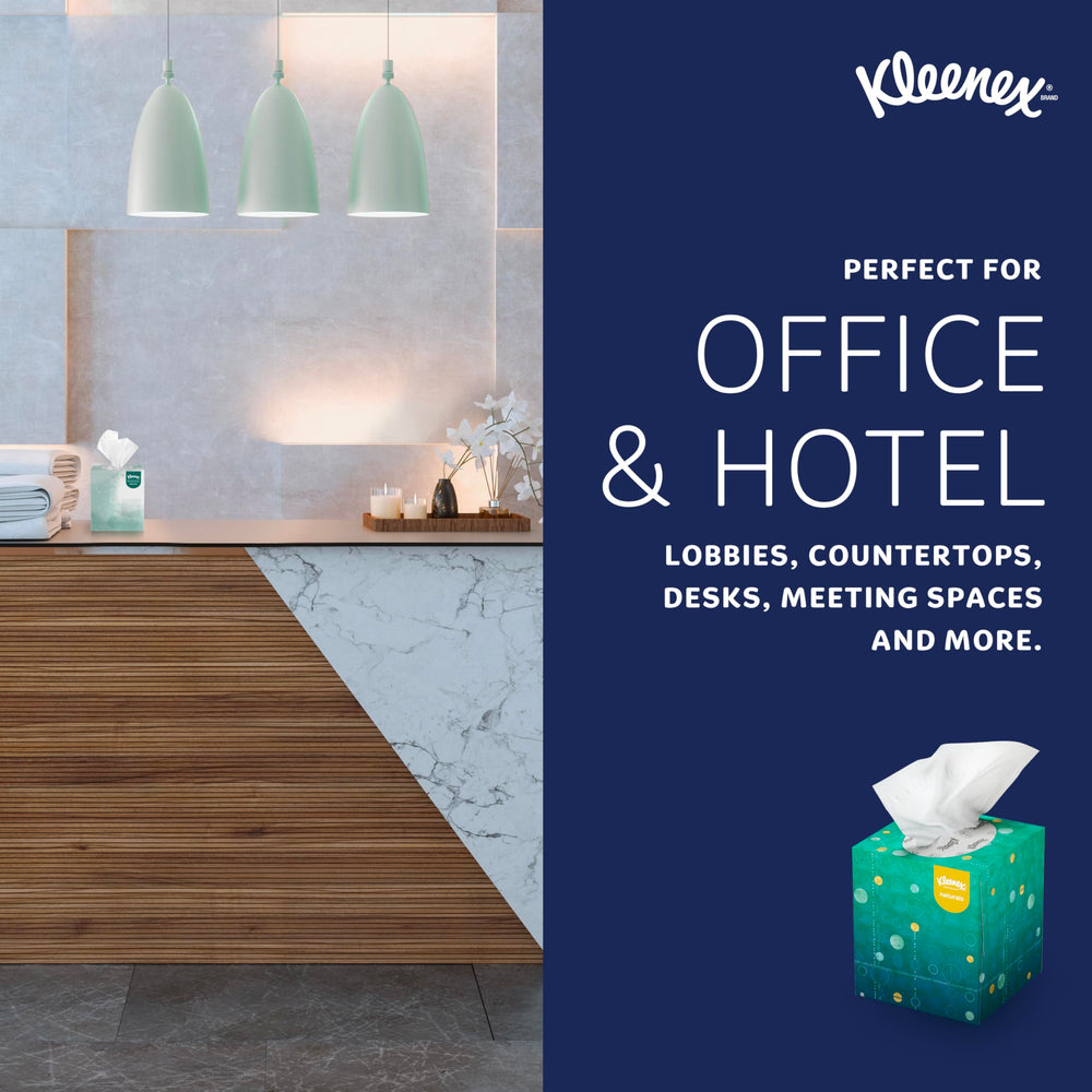 Kleenex uso en oficina: dispensador en lavabo y ambiente profesional limpio