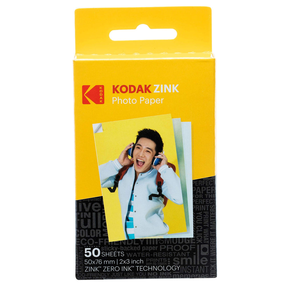 KODAK prints placed in scrapbook showing durable, sticky photos