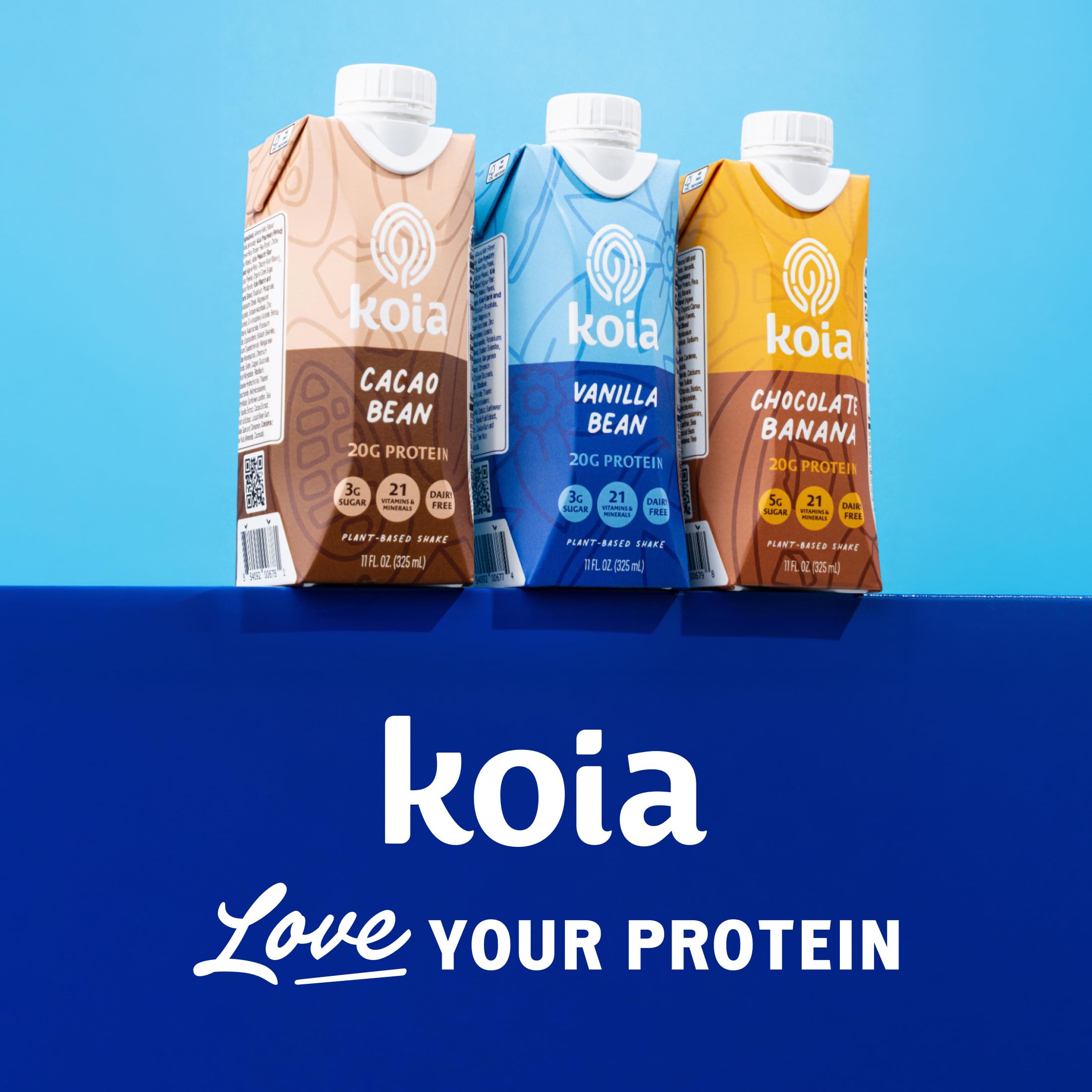 Koia botellas junto a pesas para uso como bebida post-entrenamiento