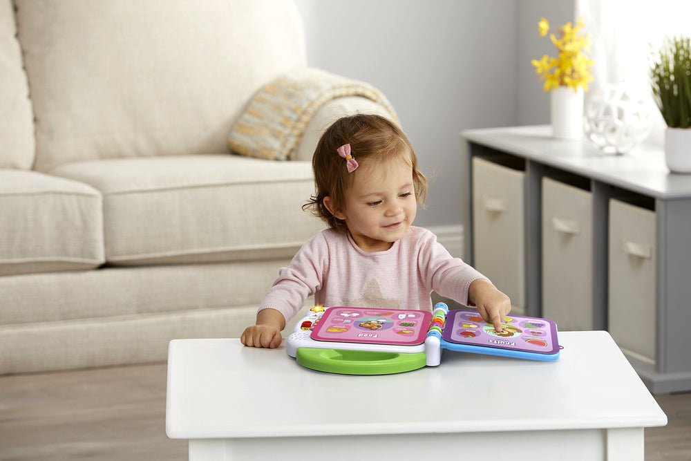 LeapFrog tamaño del libro junto a una taza para referencia clara