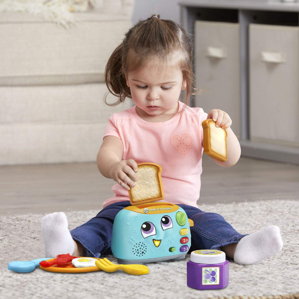 LeapFrog mano de bebé usando botones, favorece motricidad fina