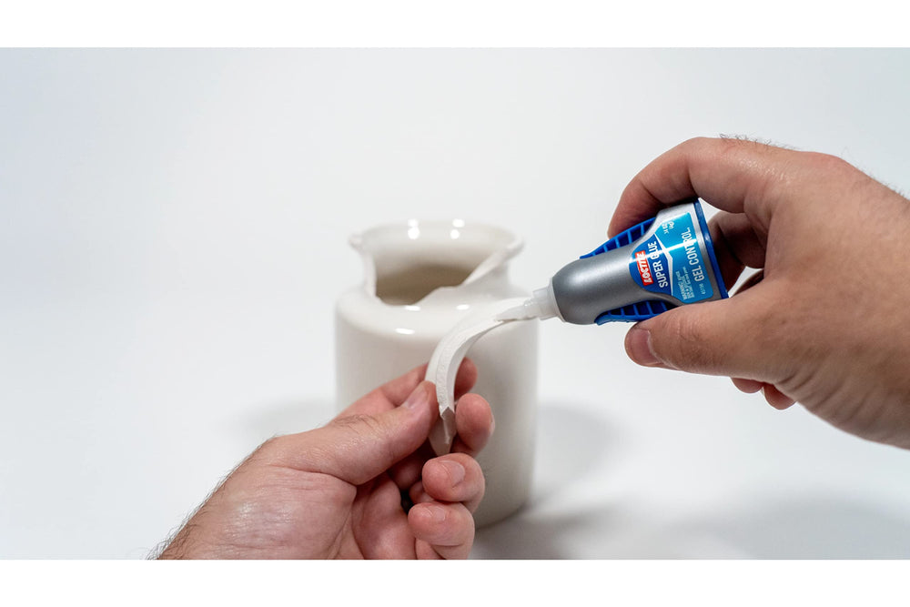 Loctite bottle among craft tools showing fast, precise glue for hobby projects