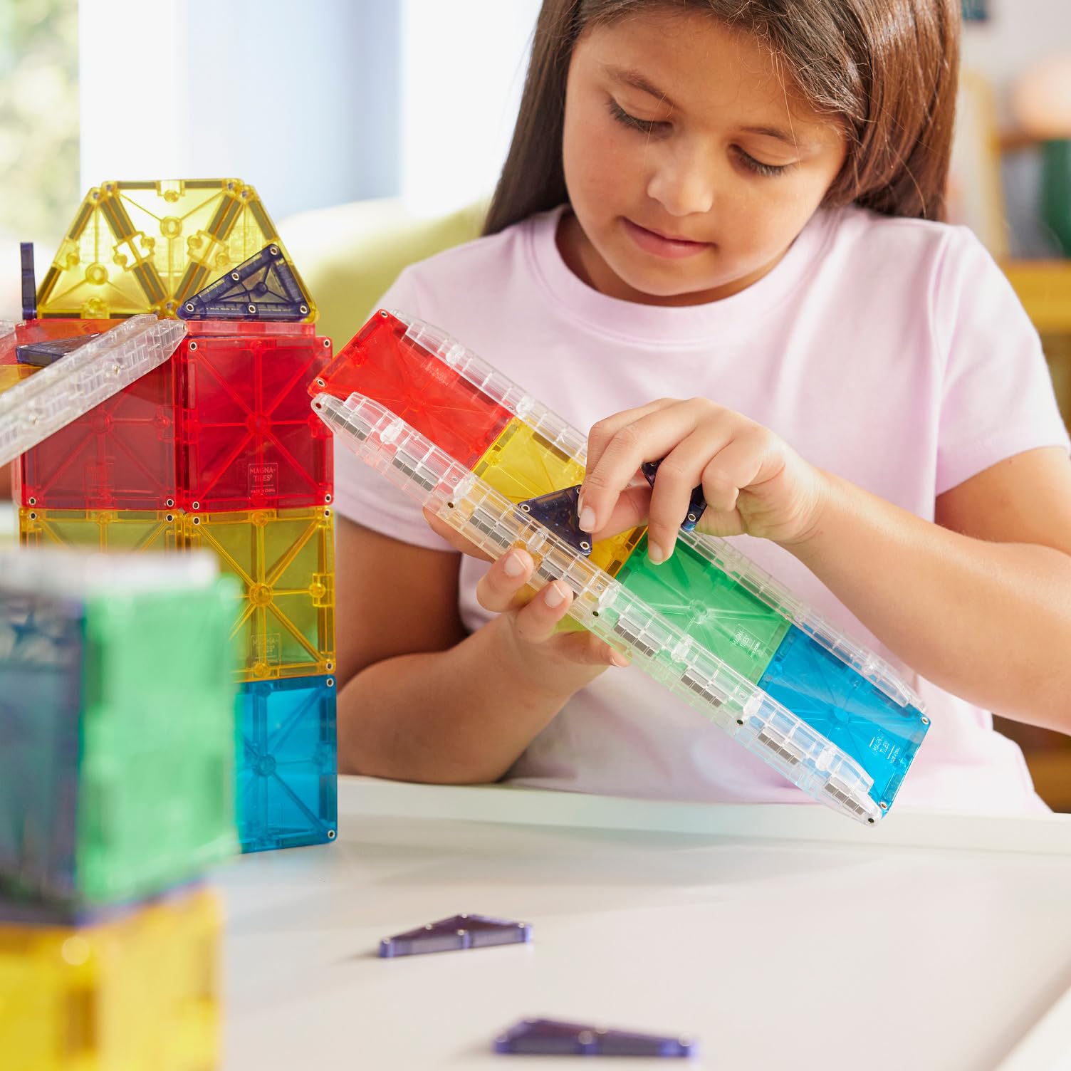 MAGNA-TILES track with balls in action illustrating speed and fun