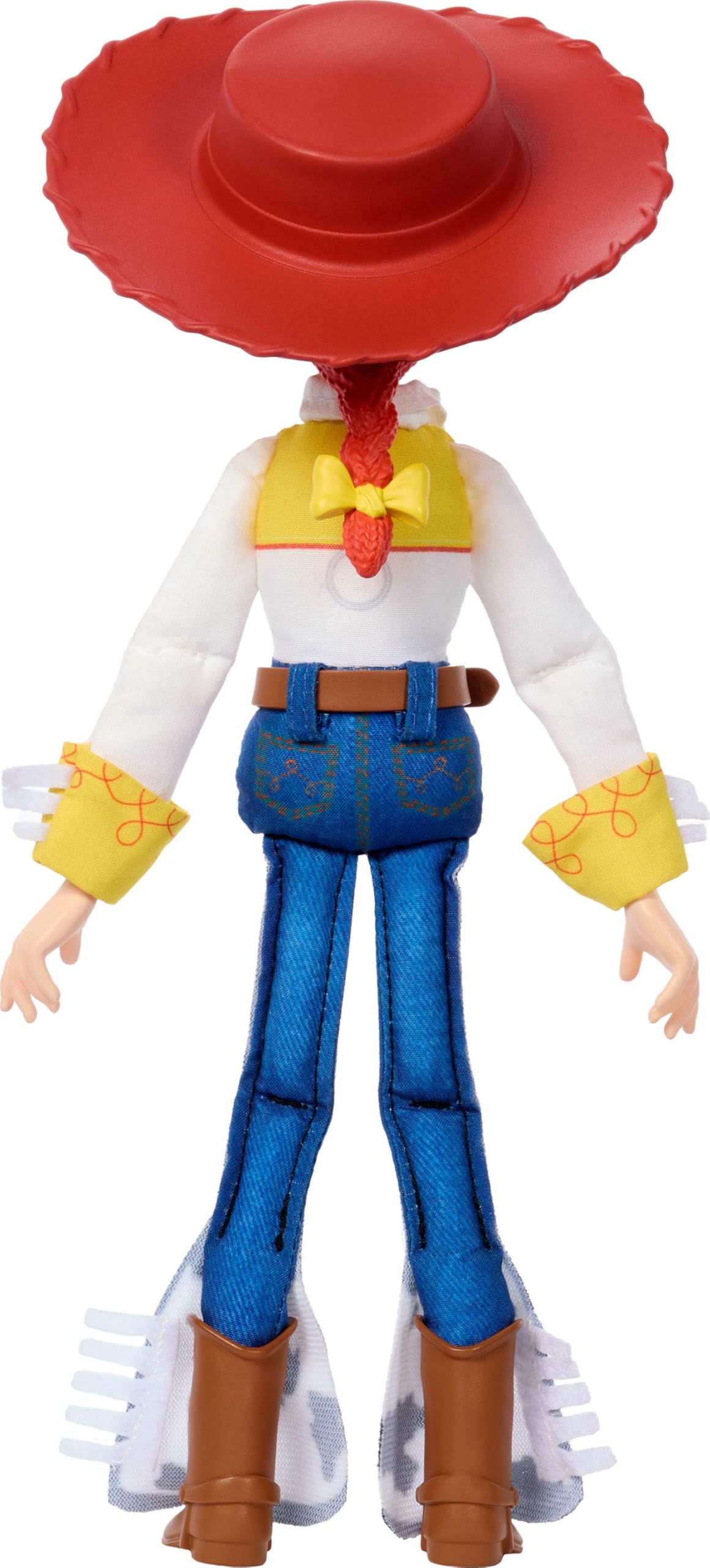 Mattel Jessie junto a regla mostrando escala de 7 pulgadas para comparación