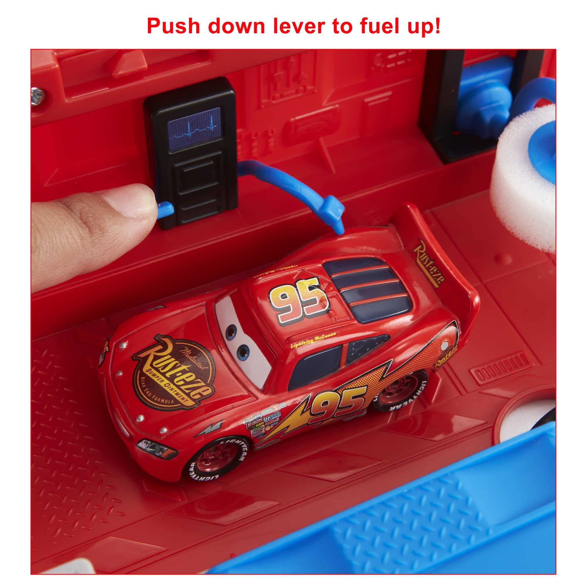 Mattel Mack Guido tire change platform in use showing quick repair interaction benefit