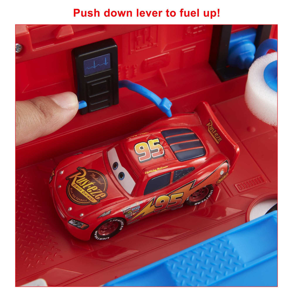 Mattel Mack Guido tire change platform in use showing quick repair interaction benefit