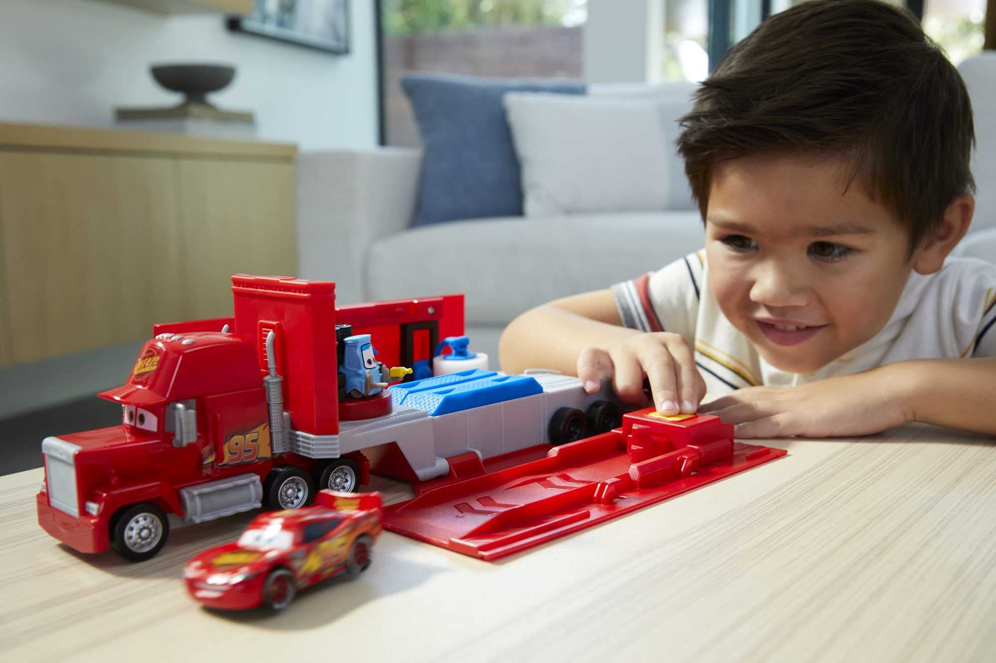 Mattel Mack lifestyle shot with child playing to show portability and engagement