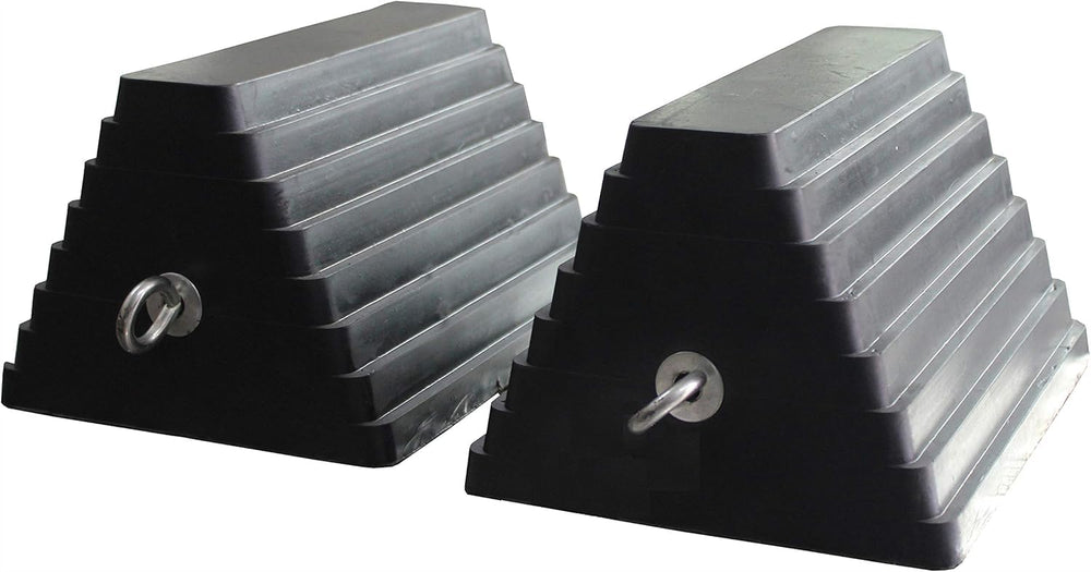 MaxxHaul chock placed under trailer wheel with eyebolt visible for secure retrieval