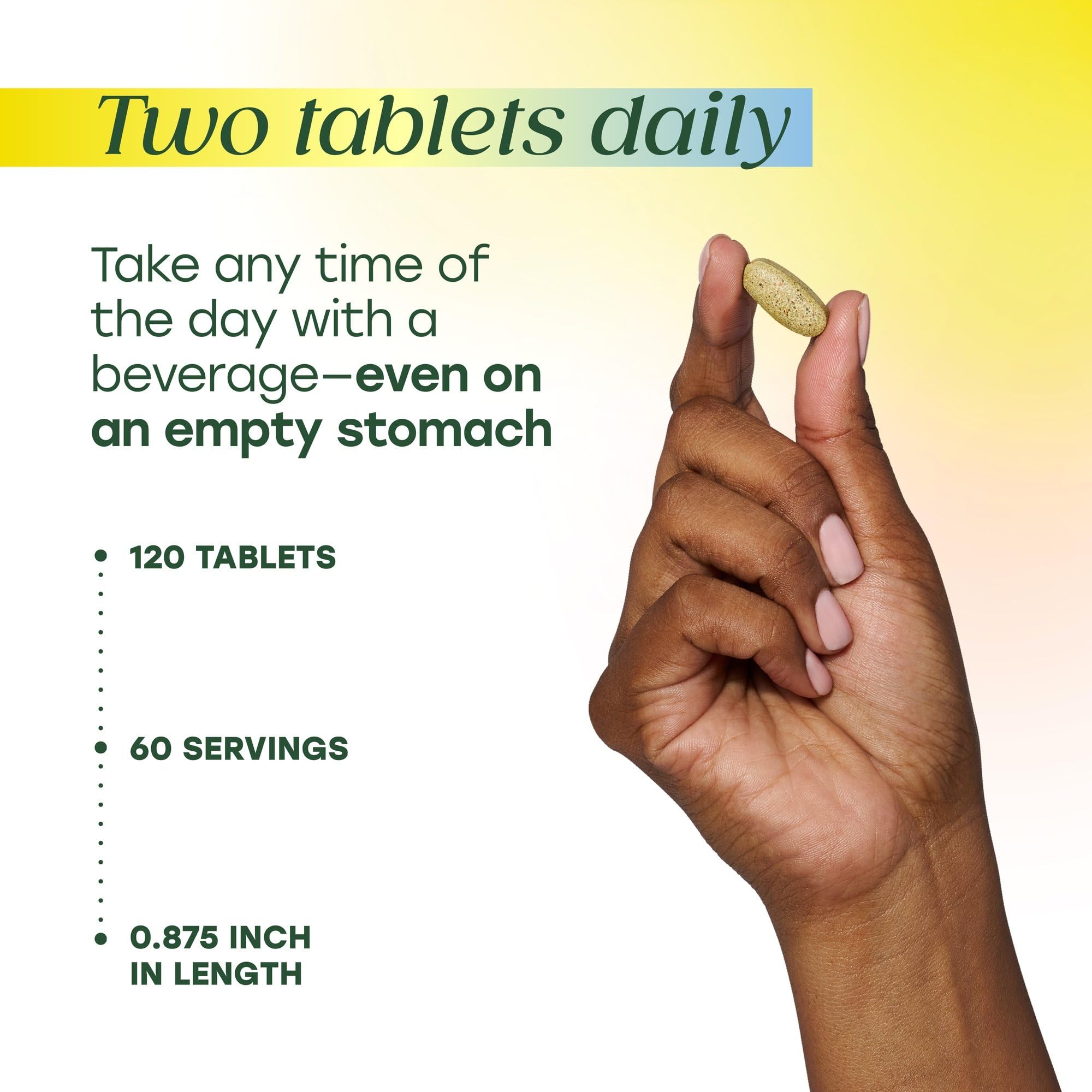 MegaFood tabletas en mano para ver tamaño y escala conveniente