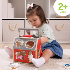 Melissa & Doug barn with roof open revealing internal storage and easy access