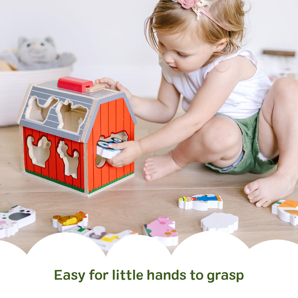 Melissa & Doug barn in a playroom scene encouraging cooperative pretend play