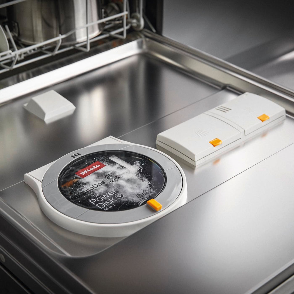 Miele PowerDisk detalle del polvo granulado que mejora la limpieza