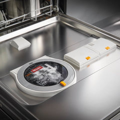 Miele PowerDisk detalle del polvo granulado que mejora la limpieza