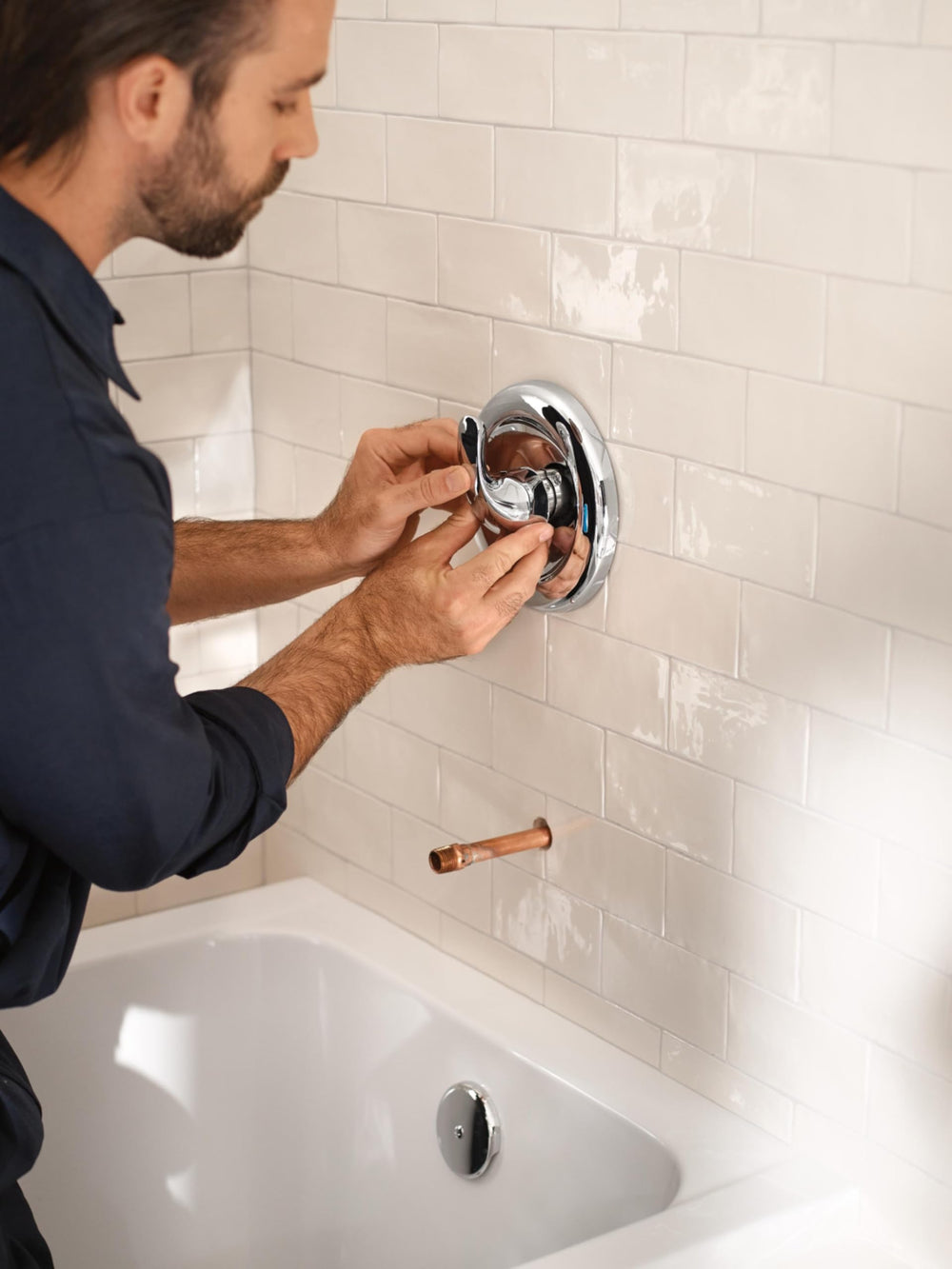 Moen valve installed in wall niche illustrating integration with tub and shower framing