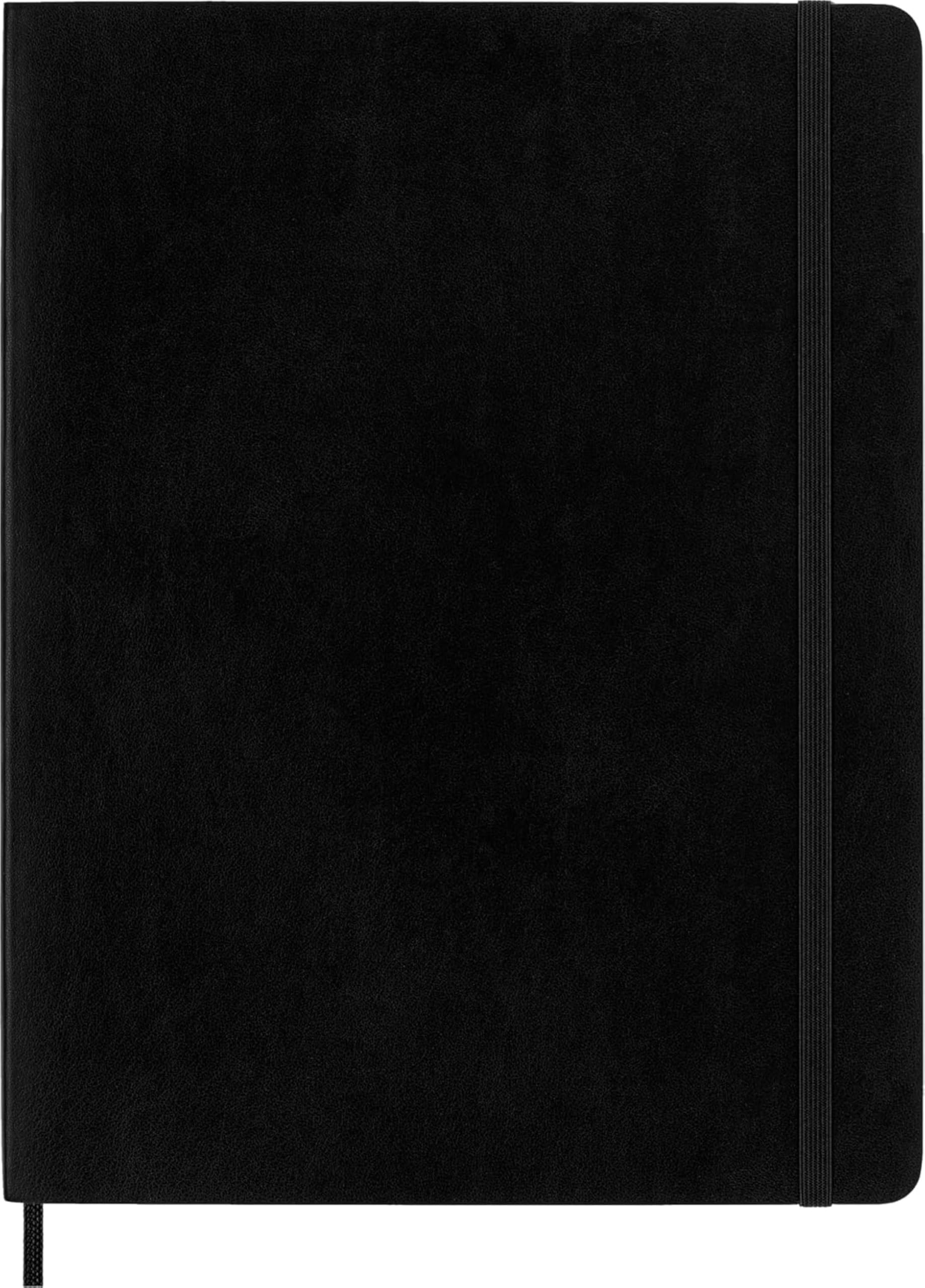 Moleskine abierto mostrando páginas rayadas, marca Moleskine y escritura clara