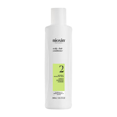 Nioxin envase frontal mostrando presentación profesional y beneficio de densidad