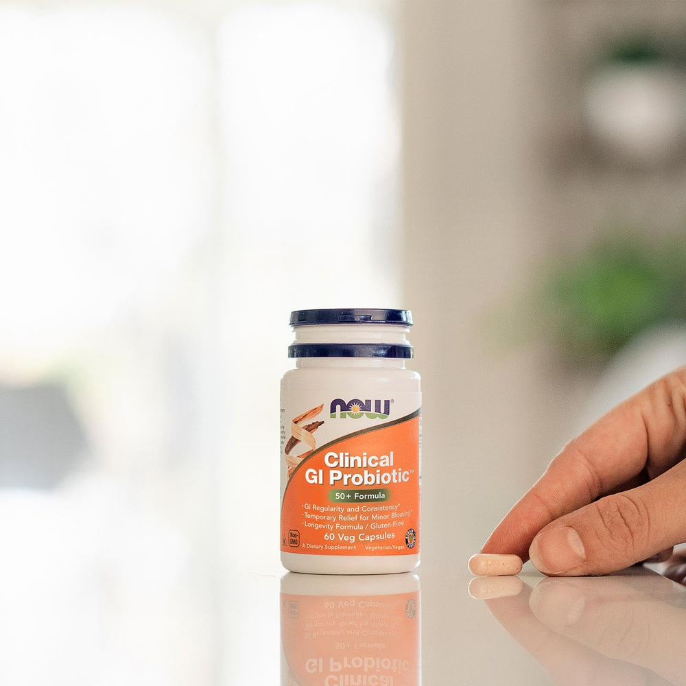 NOW Foods tamaño de cápsula comparado con moneda para referencia de escala