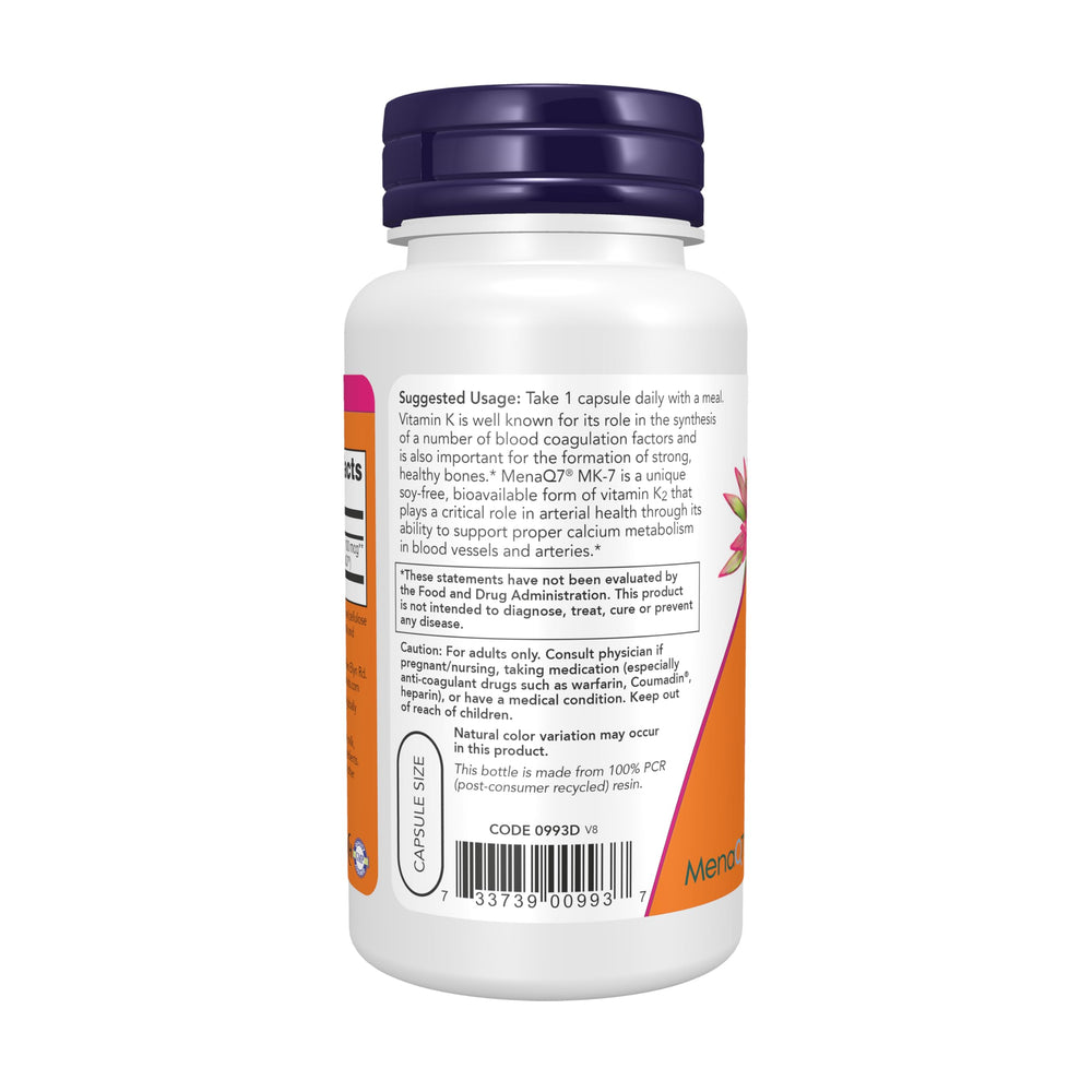 NOW Foods capsules spread on surface with a measuring tape showing capsule scale