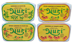 Nuri frontal del pack de cuatro latas mostrando variedad y presentación artesanal
