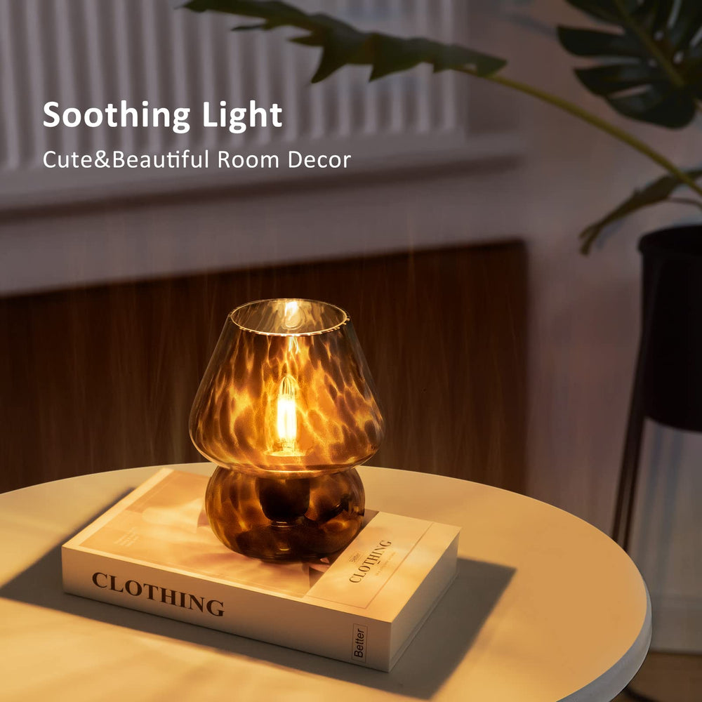 ONEWISH comparación de tamaño junto a libro mostrando escala compacta y portátil