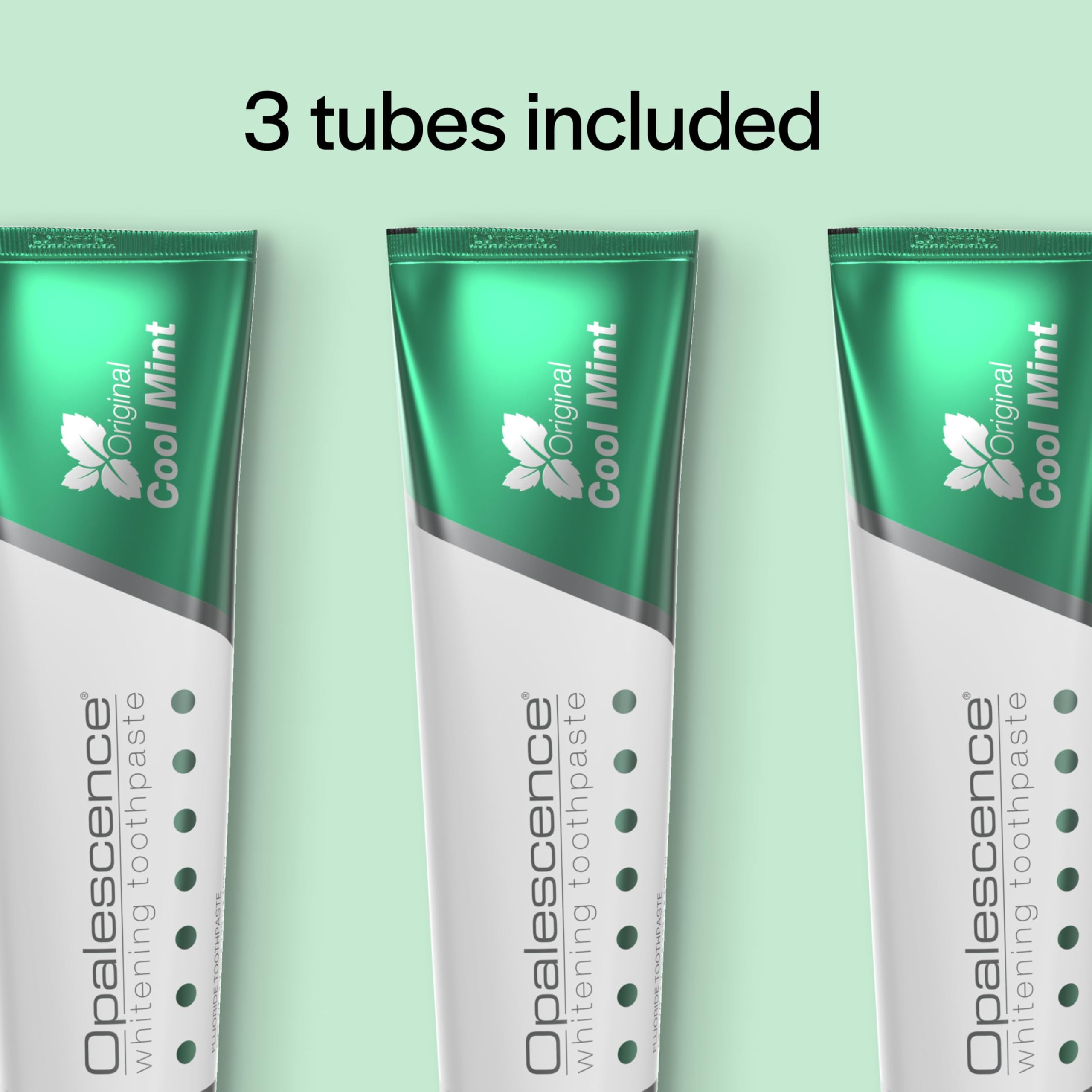 Opalescence tubo sostenido en mano para comparar tamaño y duración del producto