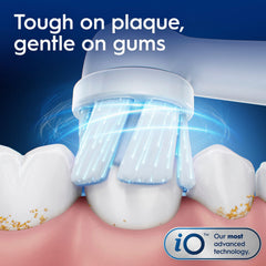 Oral-B handle in hand illustrating compact size and ergonomic grip for comfort