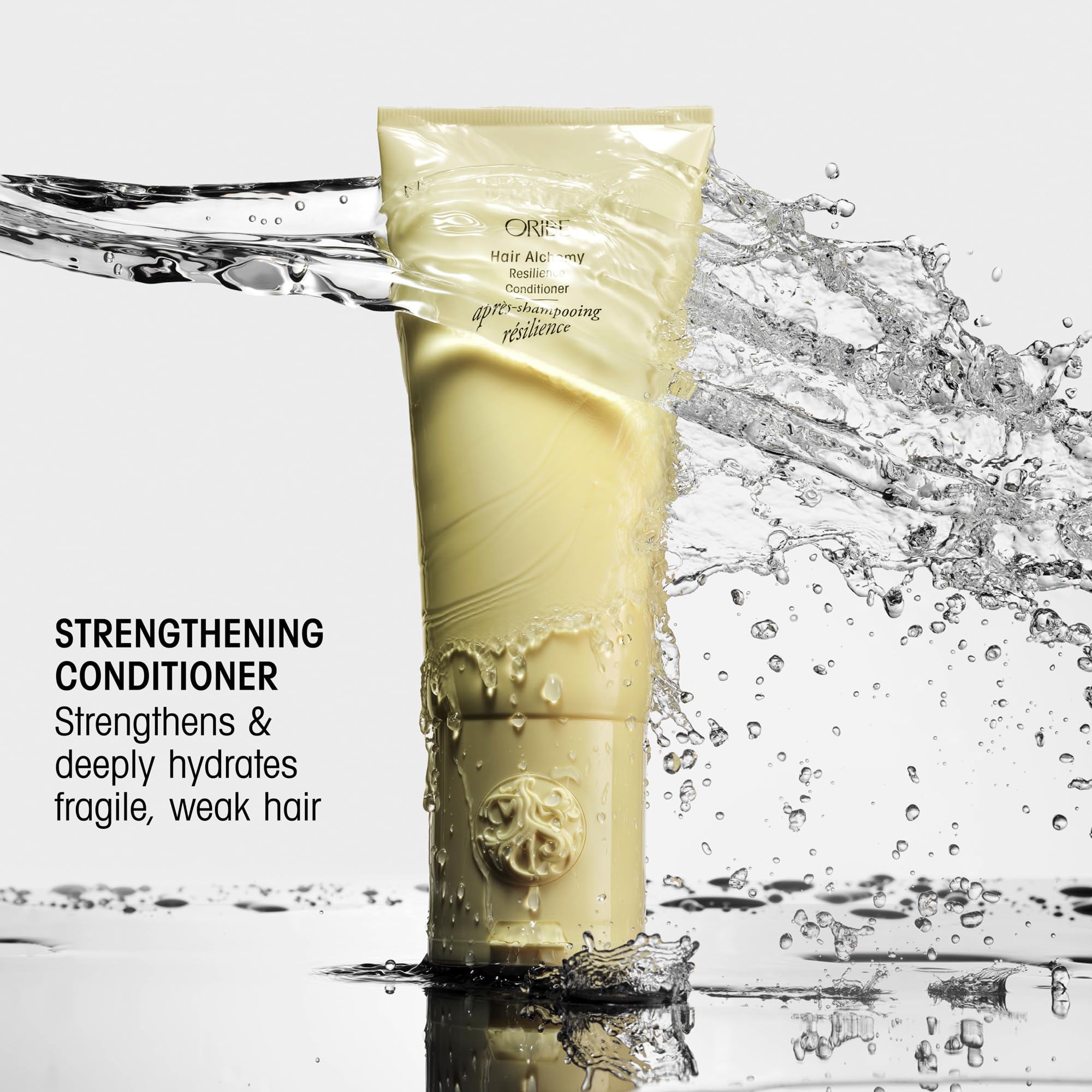 Etiqueta trasera Oribe Hair Alchemy mostrando ingredientes y beneficios claros