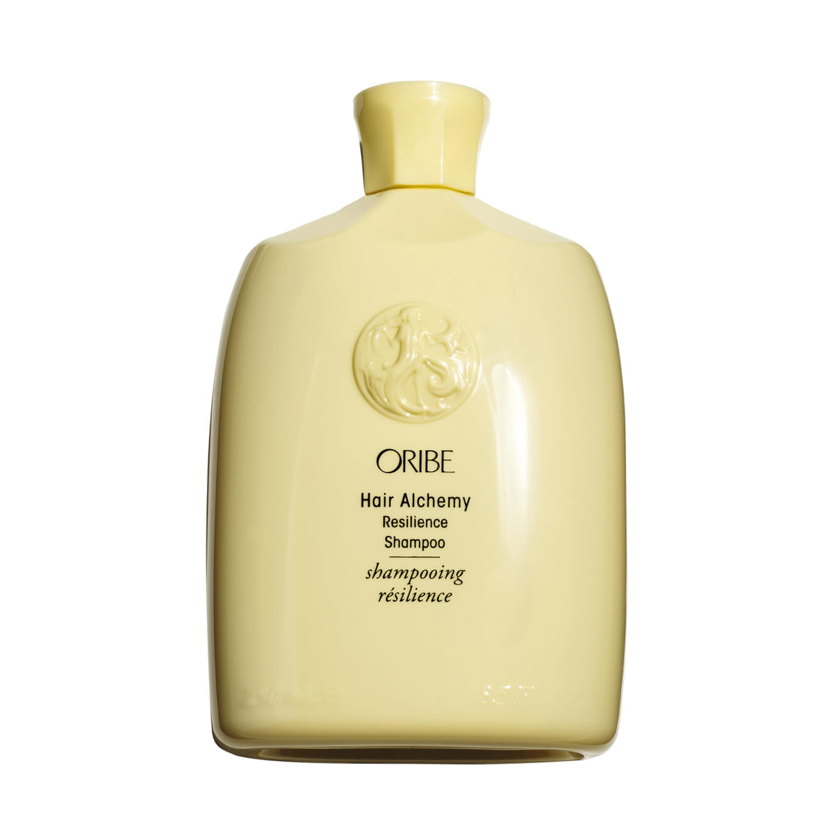 Oribe Hair Alchemy frontal mostrando botella elegante y beneficio fortalecedor