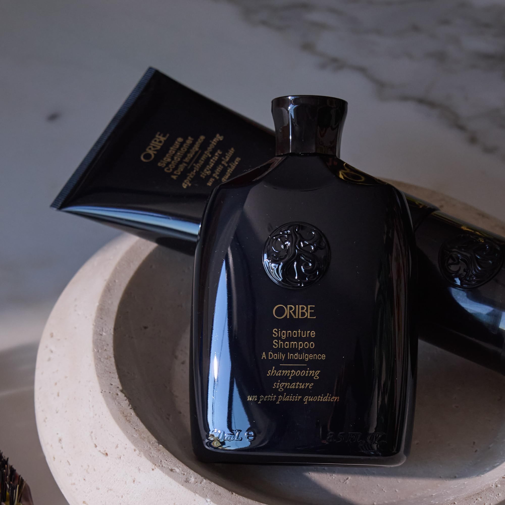 Oribe acondicionador botella abierta dosificación controlada