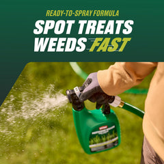 Ortho spraying lawn in use targeting weeds for quicker visible control