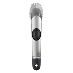 OXO cepillo frontal con mango mostrando diseño ergonómico y dosificación de jabón