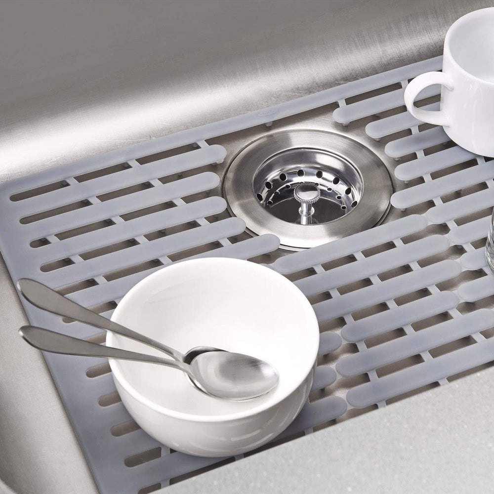 OXO colocación de una olla caliente sobre la alfombrilla protegida