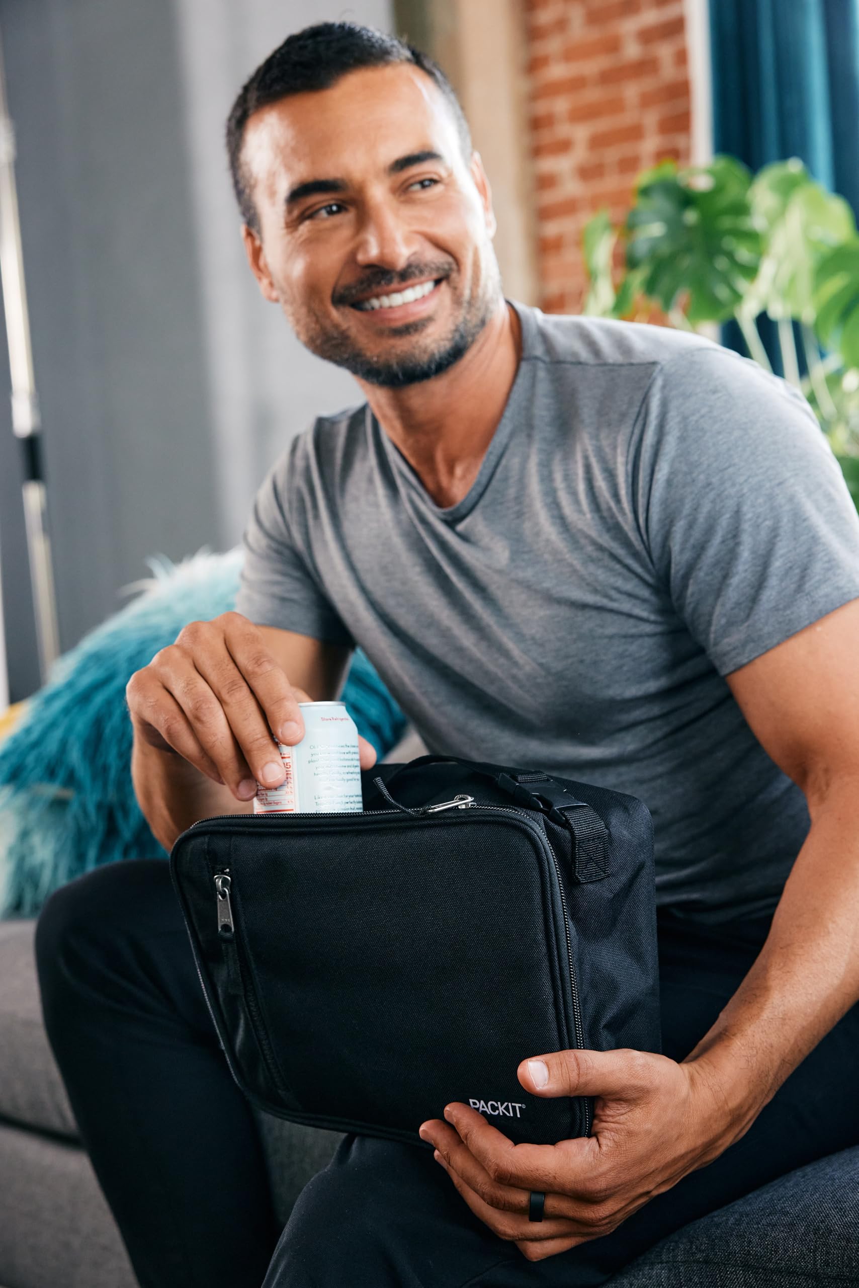 PackIt used at a desk with salad and bottle, keeps work lunch cooler longer
