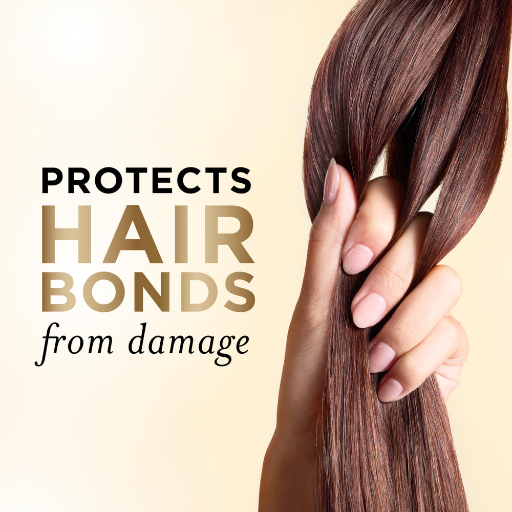 Pantene etiqueta de la botella mostrando ingredientes clave y beneficio duradero