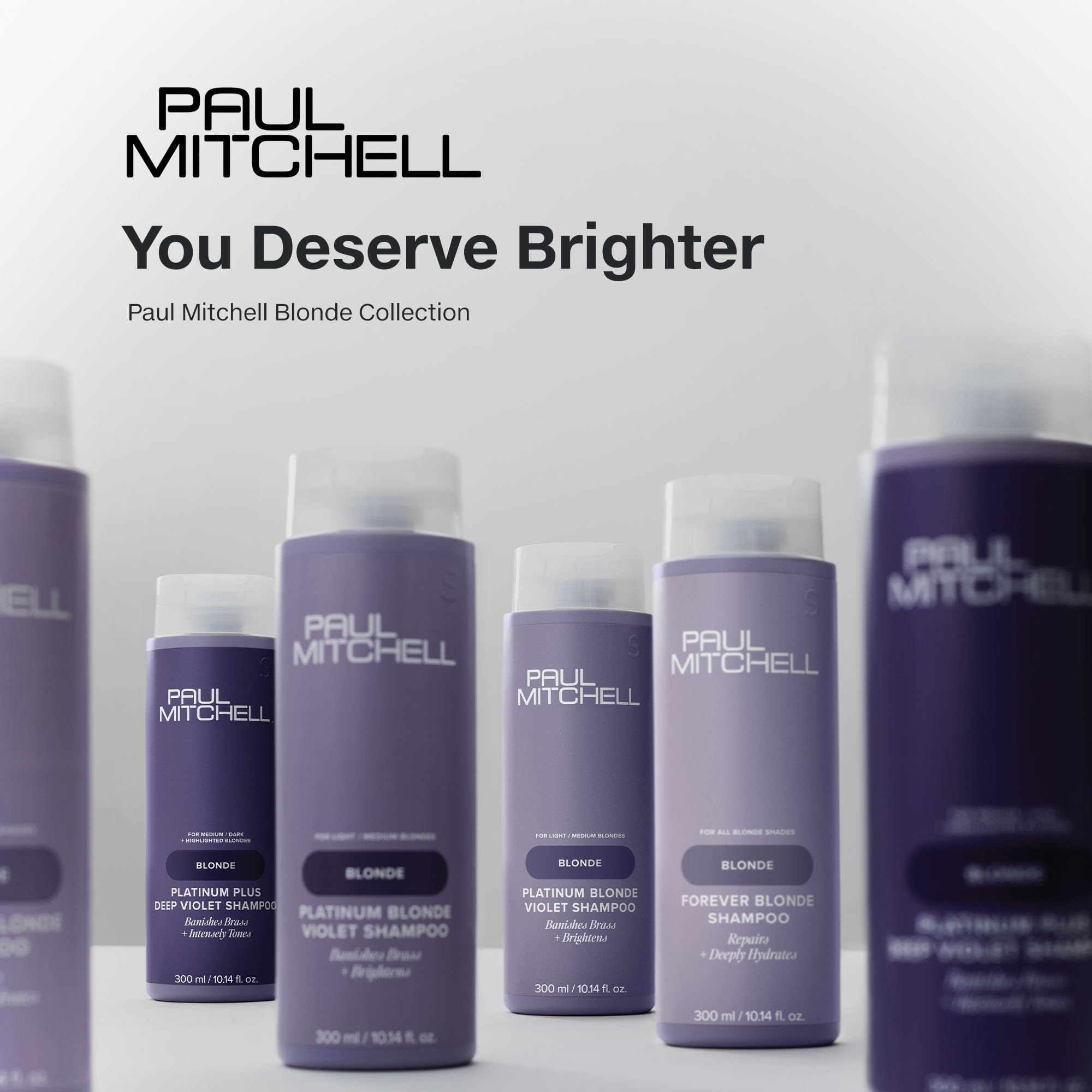 Paul Mitchell tamaño 10.14 fl oz comparado con manos para escala práctica