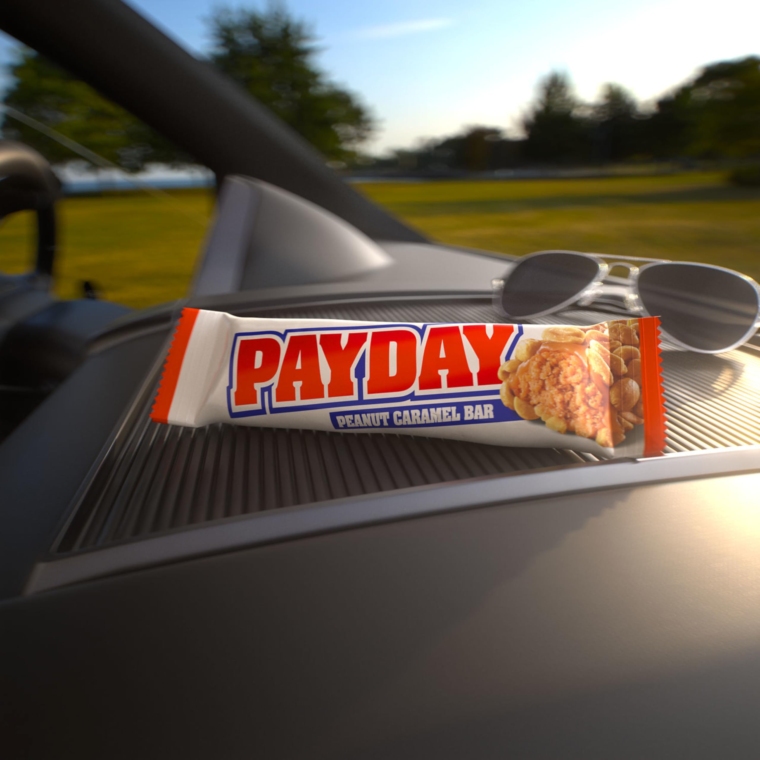 PAYDAY barra junto a regla mostrando 1.85 oz para referencia de tamaño
