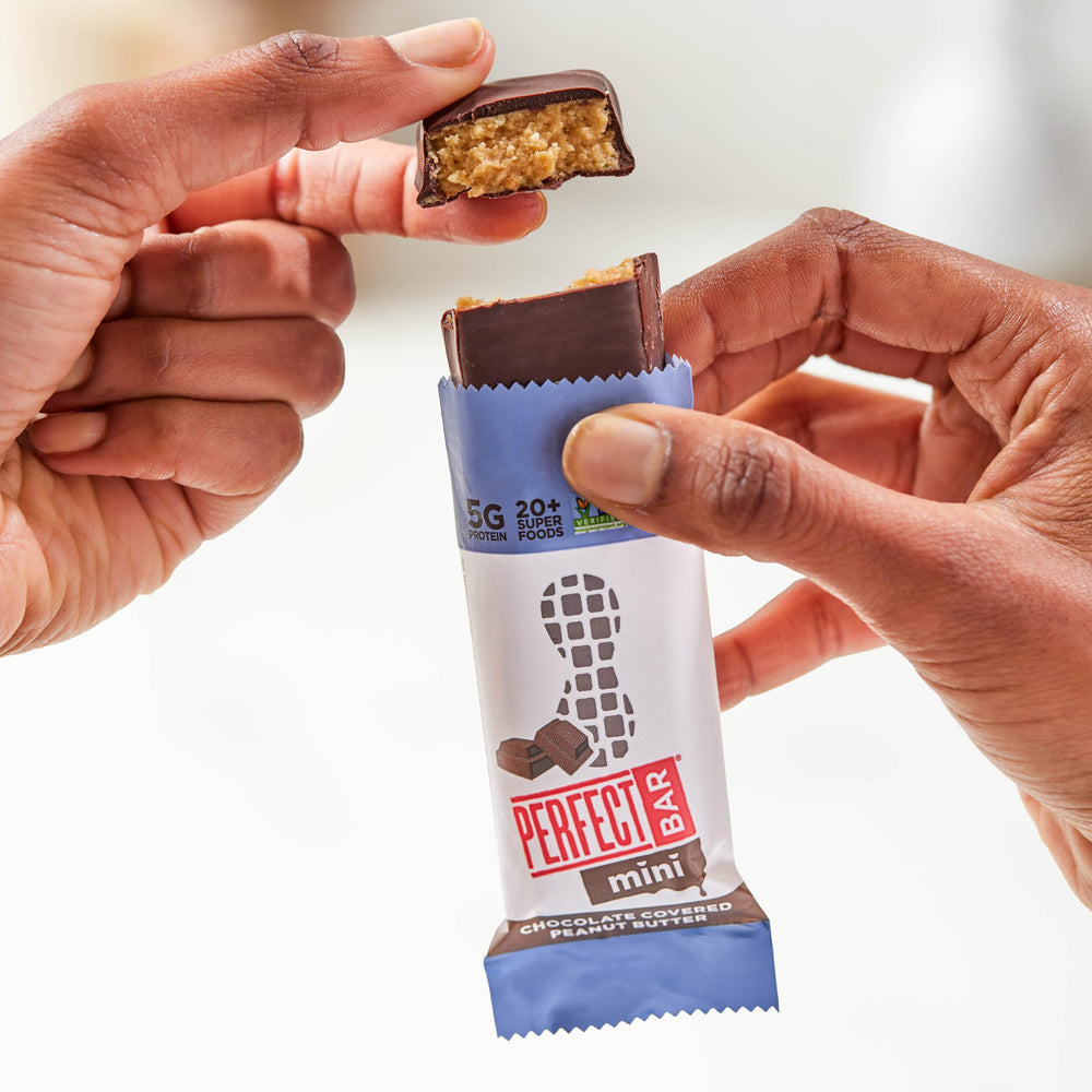 Perfect Bar mini tucked inside a kid's lunchbox, shows convenient snack portability