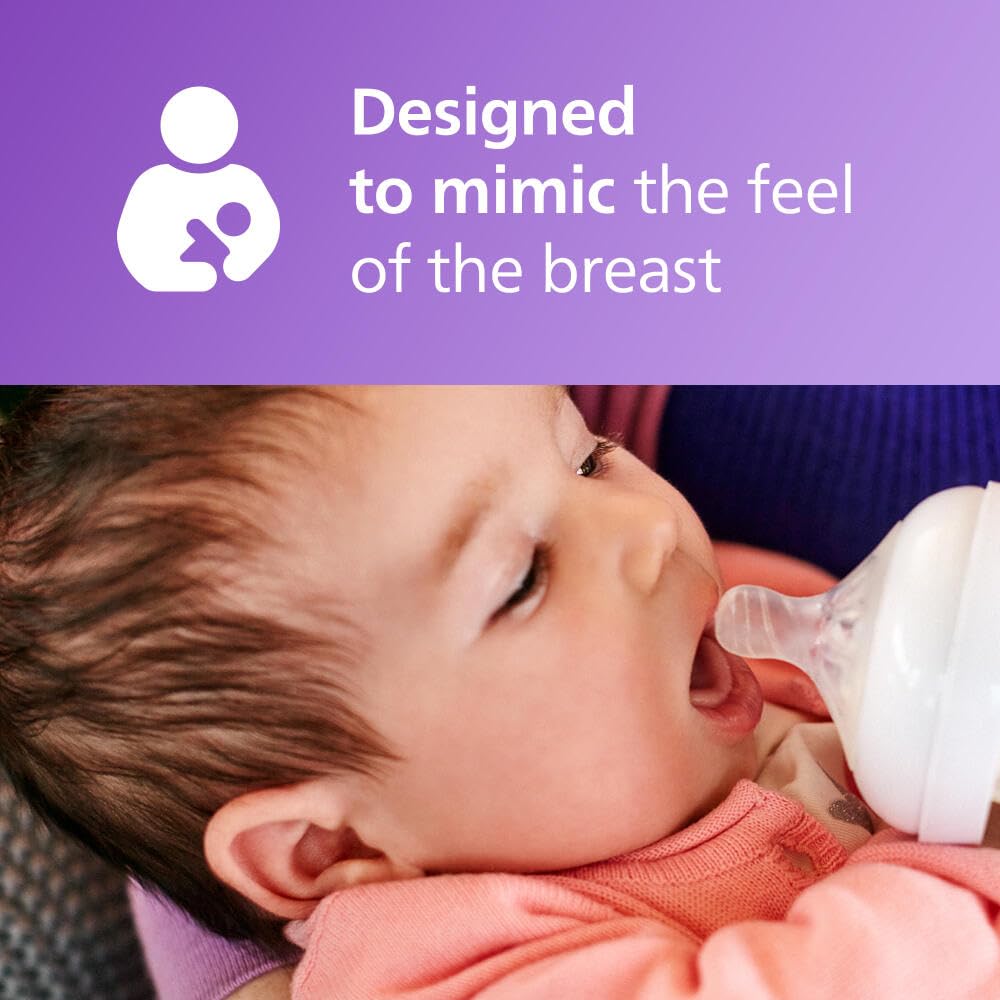 Philips Avent biberón en manos de un cuidador durante la alimentación, fácil agarre