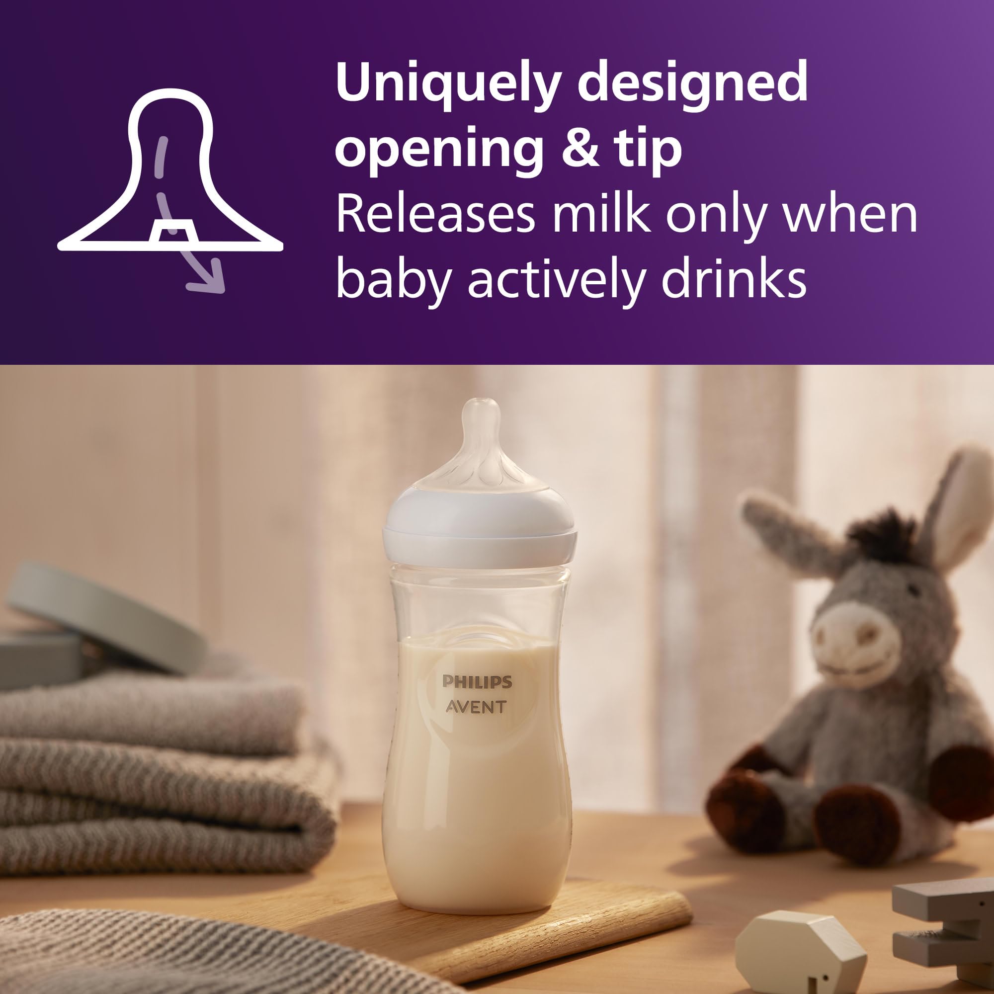 Philips Avent biberón en mano de adulto, agarre ergonómico y control
