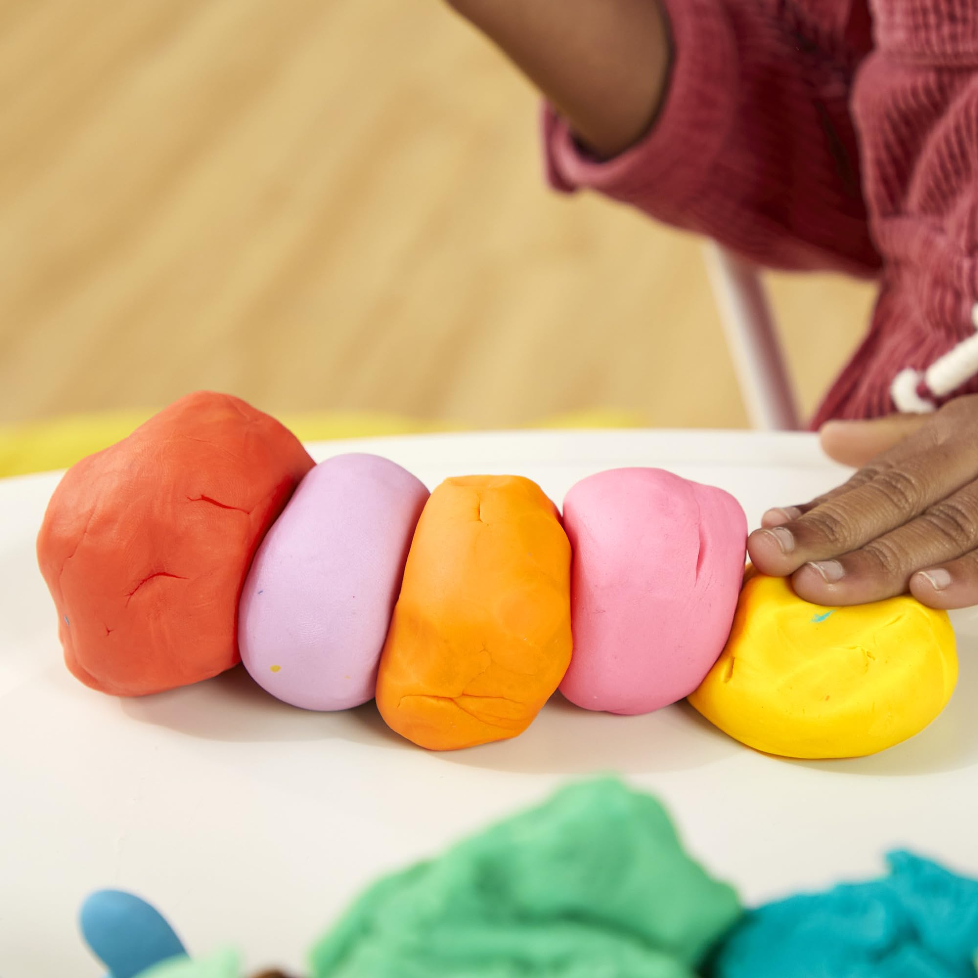Play‑Doh set arranged for classroom and party use illustrating sharing ease