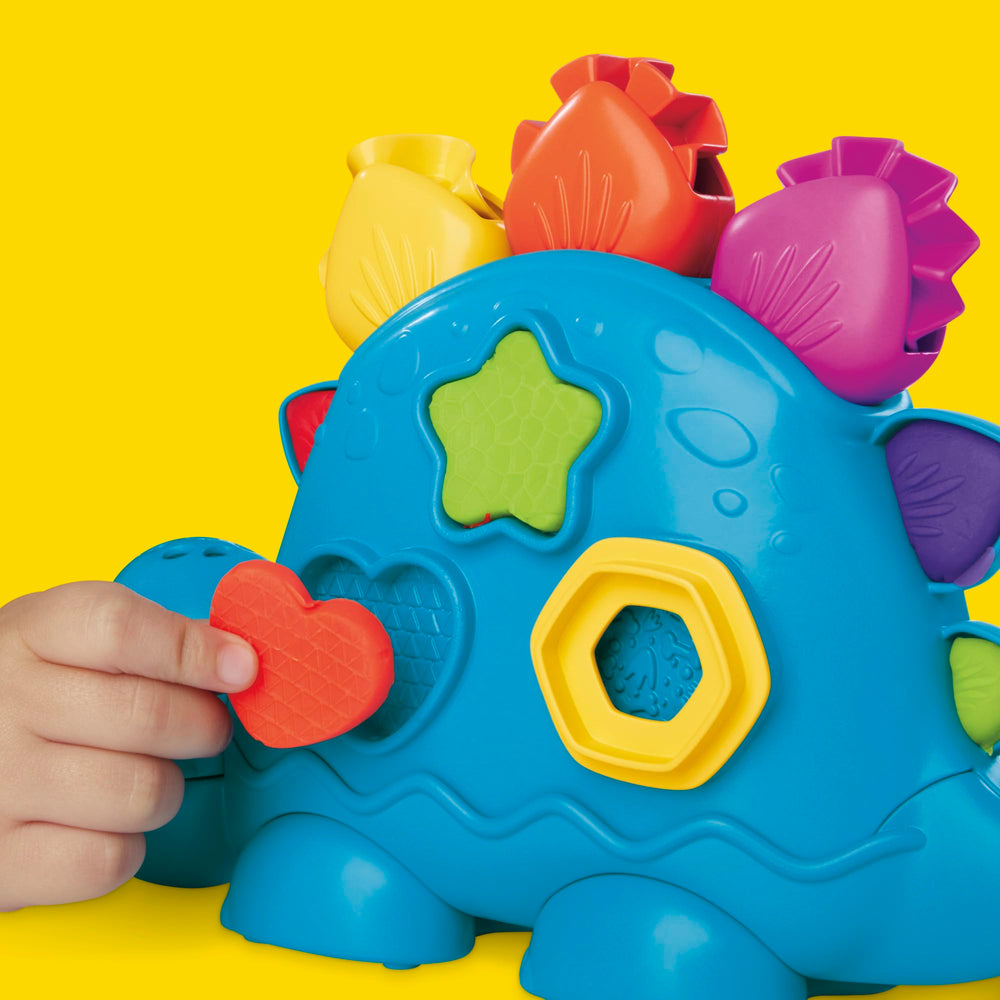 Play-Doh compartimento trasero abierto con piezas guardadas para fácil almacenamiento
