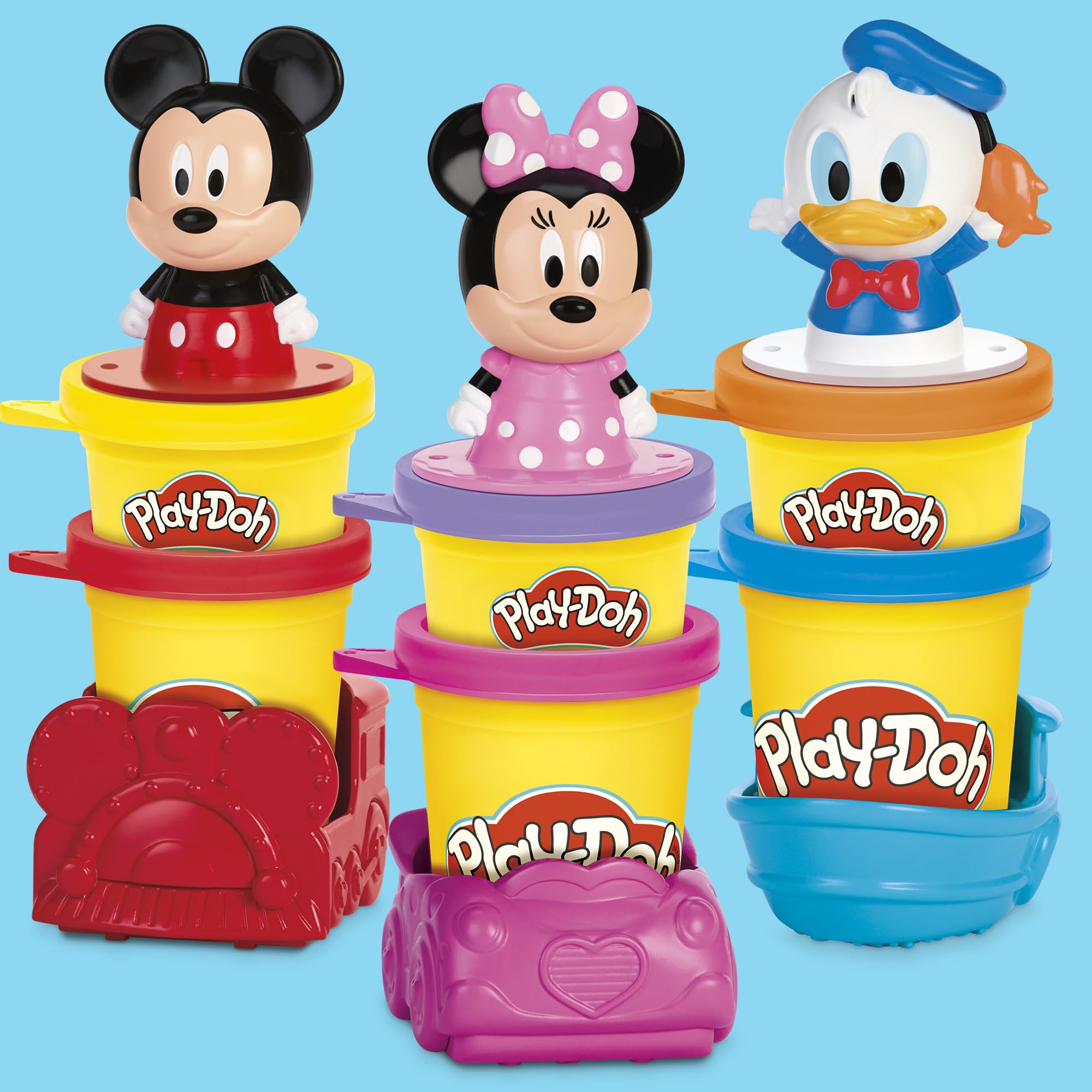 Play-Doh seis colores abiertos sobre mesa para compartir creatividad