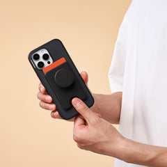 PopSockets acoplado a iPhone MagSafe mostrando alineación magnética