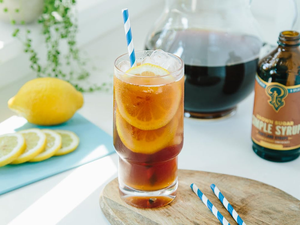 Portland Syrups cucharilla midiendo porción para dosificación precisa