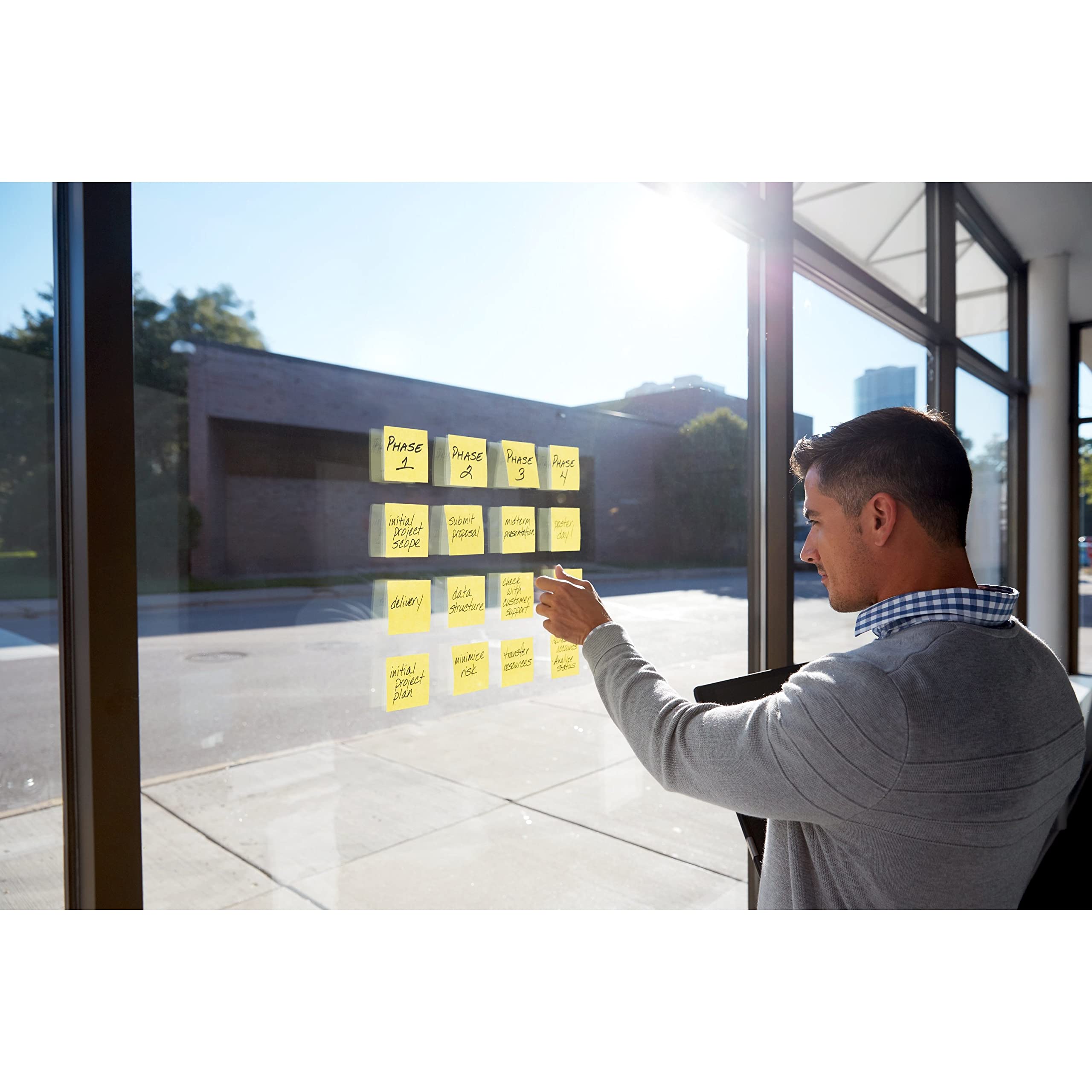 Post-it close-up adhesive edge showing Super Sticky glue benefit: stronger hold