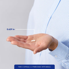 Pure Encapsulations cápsula junto a moneda para comparar tamaño