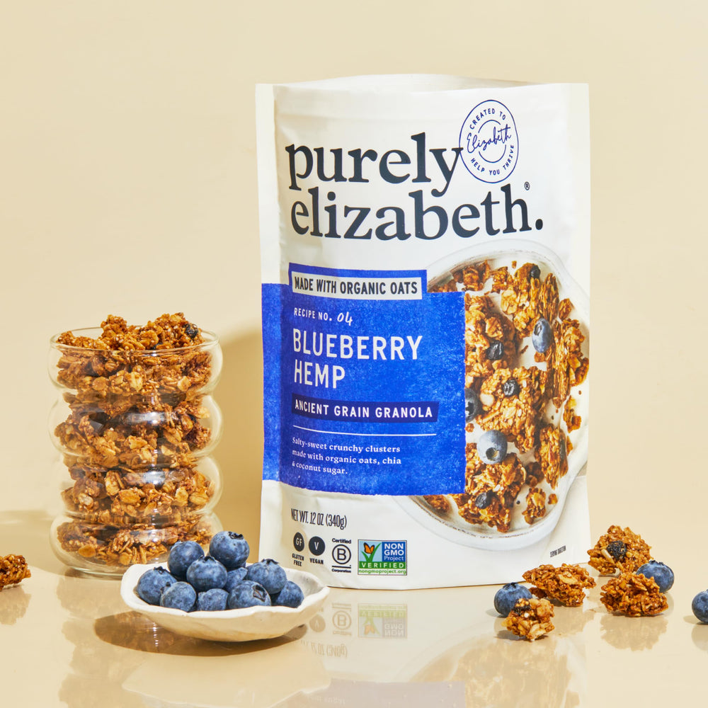 Purely Elizabeth granola served in bowl with yogurt showing added flavor boost