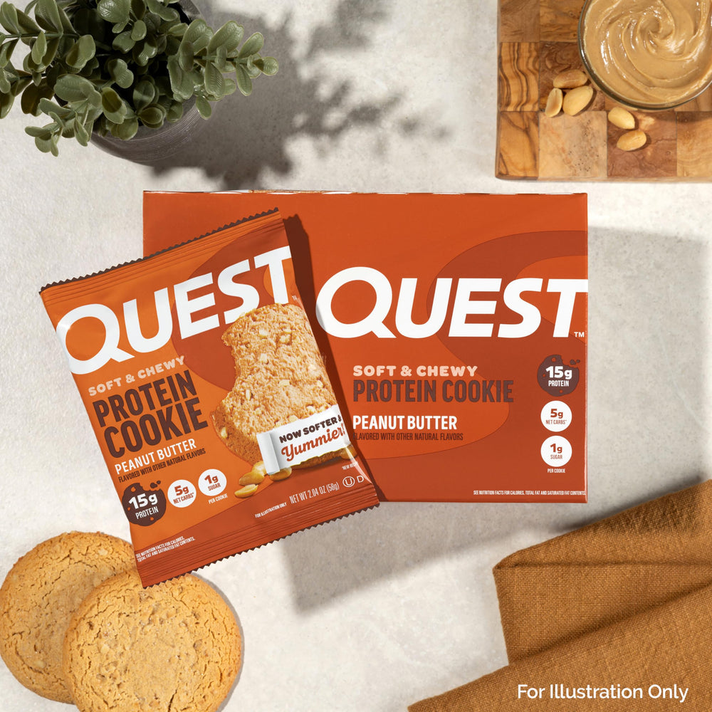 Quest cookie beside a water bottle and notebook for workplace refuel